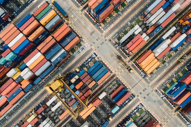 Stacked shipping containers at a commercial port yard